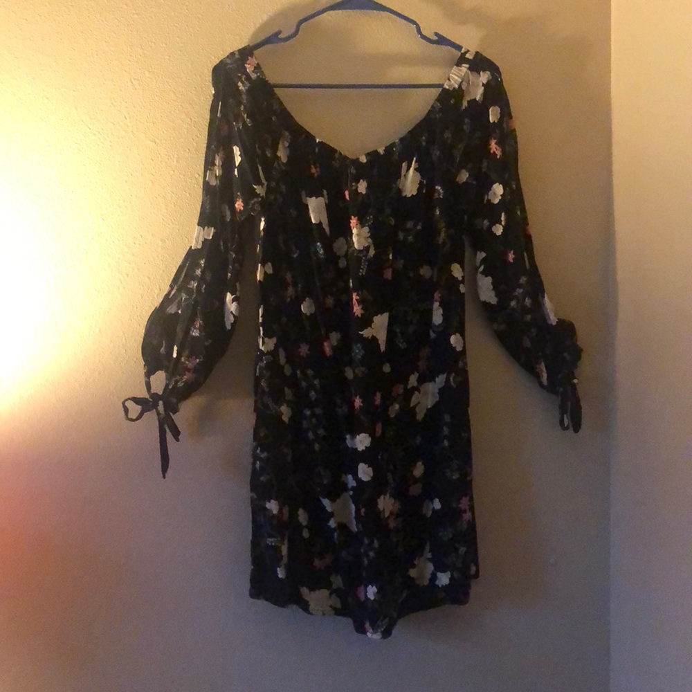 Selling a black off the shoulder floral dress.